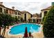 Inviting community pool with lounge chairs and lush landscaping at the Tuscany Condominiums at 955 Juniper Ne St # 4229, Atlanta, GA 30309