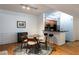 Cozy dining area with glass table, seating for four, and breakfast bar area at 955 Juniper Ne St # 4229, Atlanta, GA 30309