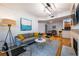 Cozy living room with neutral furniture, fireplace, and open concept to dining area at 955 Juniper Ne St # 4229, Atlanta, GA 30309