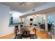Open-concept living room with hardwood floors, fireplace, and bright windows to balcony at 955 Juniper Ne St # 4229, Atlanta, GA 30309