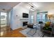 Bright living room with hardwood flooring, fireplace, and access to outdoor balcony at 955 Juniper Ne St # 4229, Atlanta, GA 30309