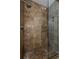 The shower features stone walls, tiled floors, and a glass door at 955 Juniper Ne St # 4229, Atlanta, GA 30309