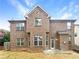 Spacious backyard with a brick exterior and a small patio at 2100 Trinity Mill Dr, Dacula, GA 30019