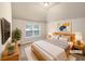 Comfortable bedroom featuring a large window and neutral decor at 2100 Trinity Mill Dr, Dacula, GA 30019