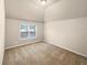 Simple bedroom with carpet and ample natural light at 2100 Trinity Mill Dr, Dacula, GA 30019