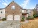 Charming brick home with a two-car garage and well-maintained landscaping at 2100 Trinity Mill Dr, Dacula, GA 30019