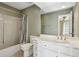 A bathroom with a tub and a single sink vanity at 3454 Ashwood Ln, Atlanta, GA 30341