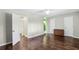 Bedroom with wood floors, ceiling fan, closet, and access to other rooms at 3454 Ashwood Ln, Atlanta, GA 30341