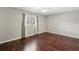 Bedroom featuring wood floors, ceiling fan, and natural light at 3454 Ashwood Ln, Atlanta, GA 30341