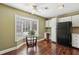 Cozy eat-in kitchen with breakfast nook, white cabinets, and stainless steel refrigerator at 3454 Ashwood Ln, Atlanta, GA 30341