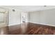 Large living room with hardwood floors, neutral walls, and a view into the kitchen at 3454 Ashwood Ln, Atlanta, GA 30341