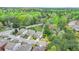 Beautiful two-story home with mature trees and landscaping on a large lot in a suburban neighborhood near a main road at 6845 Rocking Horse Ln, Cumming, GA 30040