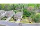 Aerial view highlighting property lines of a brick home with manicured front lawn and a long driveway at 6845 Rocking Horse Ln, Cumming, GA 30040