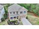 Brick home with blue shutters and a well-manicured lawn in a desirable neighborhood at 6845 Rocking Horse Ln, Cumming, GA 30040