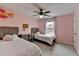 Charming bedroom featuring twin beds, a ceiling fan, and a cozy workspace perfect for children or guests at 6845 Rocking Horse Ln, Cumming, GA 30040