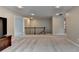 Spacious bonus room with plush carpet, recessed lighting, and stairway at 6845 Rocking Horse Ln, Cumming, GA 30040