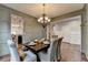 Formal dining room shows open floorplan and chair rail at 6845 Rocking Horse Ln, Cumming, GA 30040
