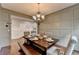 Formal dining room showcases bench seating and stylish wainscoting at 6845 Rocking Horse Ln, Cumming, GA 30040