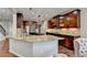 Gourmet kitchen features granite counters, stainless appliances and custom cabinets at 6845 Rocking Horse Ln, Cumming, GA 30040