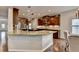 Gourmet kitchen showcases granite counters, stainless appliances, and custom wood cabinets at 6845 Rocking Horse Ln, Cumming, GA 30040