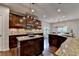 Gourmet kitchen boasts stainless appliances and breakfast bar at 6845 Rocking Horse Ln, Cumming, GA 30040
