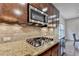 The kitchen offers gas range and stainless microwave at 6845 Rocking Horse Ln, Cumming, GA 30040
