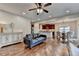 Living room open to dining and kitchen, hardwood floors throughout at 6845 Rocking Horse Ln, Cumming, GA 30040
