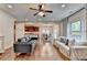 Spacious living room connects to kitchen and dining area, perfect for entertaining at 6845 Rocking Horse Ln, Cumming, GA 30040