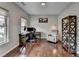 Cozy office space with hardwood floors, a work desk, and natural light at 6845 Rocking Horse Ln, Cumming, GA 30040