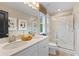 Elegant bathroom with double sinks, quartz countertop, and glass-enclosed shower at 125 Werner Brook Sw Way, Atlanta, GA 30354