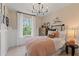 Comfortable bedroom with neutral tones, a twin bed, and a large window offering a pleasant view at 125 Werner Brook Sw Way, Atlanta, GA 30354