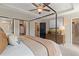 Bedroom featuring a luxurious bed, wooden dresser, and access to the bathroom at 125 Werner Brook Sw Way, Atlanta, GA 30354