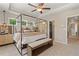 Cozy bedroom featuring a four-poster bed, neutral tones, and ample natural light at 125 Werner Brook Sw Way, Atlanta, GA 30354