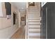 Welcoming foyer with staircase and attractive decor, enhanced by abundant natural light, creating a warm ambiance at 125 Werner Brook Sw Way, Atlanta, GA 30354