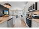 Modern kitchen with stainless steel appliances, island, and an open view to the living area at 125 Werner Brook Sw Way, Atlanta, GA 30354