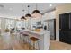 Bright kitchen boasts stainless steel appliances, a large center island, and seamless flow to the dining room at 125 Werner Brook Sw Way, Atlanta, GA 30354