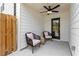 Charming covered patio with comfortable seating and a ceiling fan at 125 Werner Brook Sw Way, Atlanta, GA 30354
