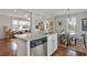 Open kitchen with a granite island bar and stainless steel appliances at 1916 Cannon St, Decatur, GA 30032