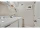Laundry room featuring modern appliances, a wire shelf, and neutral walls at 1916 Cannon St, Decatur, GA 30032