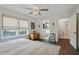 Main bedroom with hardwood floors, a ceiling fan, and bright windows at 1916 Cannon St, Decatur, GA 30032