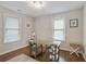 Office with hardwood floors, neutral walls, bright windows, and stylish light fixture at 1916 Cannon St, Decatur, GA 30032