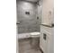 Beautifully updated bathroom featuring stylish gray tile and modern fixtures at 197 Upshaw Sw St, Atlanta, GA 30315