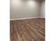Spacious room with stunning wood-look flooring, ample lighting, and neutral walls at 197 Upshaw Sw St, Atlanta, GA 30315
