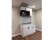 Modern kitchenette features white cabinets, sleek black hardware, and a tiled backsplash at 197 Upshaw Sw St, Atlanta, GA 30315