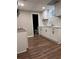 Basement kitchenette featuring white cabinets, countertop, and a view into an adjacent bathroom at 197 Upshaw Sw St, Atlanta, GA 30315