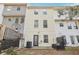 Backyard exterior features three-story building and a small patio at 103 Timber Ridge Dr, Cartersville, GA 30121