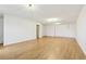 An unfinished basement features hardwood floors, closet, and white walls at 103 Timber Ridge Dr, Cartersville, GA 30121
