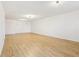 An unfinished basement features hardwood floors and white walls at 103 Timber Ridge Dr, Cartersville, GA 30121