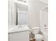 Bathroom with white sink, mirror, toilet, and shower and tub combo with white tile at 103 Timber Ridge Dr, Cartersville, GA 30121