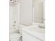 Bathroom with white sink, mirror, toilet, and shower and tub combo with white tile at 103 Timber Ridge Dr, Cartersville, GA 30121